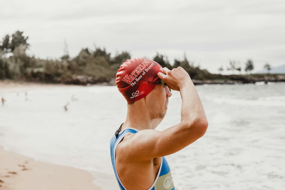 Adult swimmer receiving coaching feedback in a pool