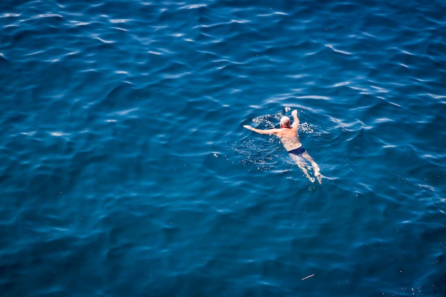 Adult swimmer building confidence with a private swim teacher