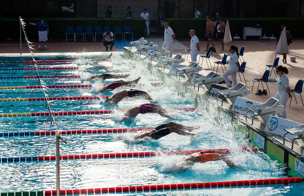 Adult swimmer receiving technical coaching in the pool
