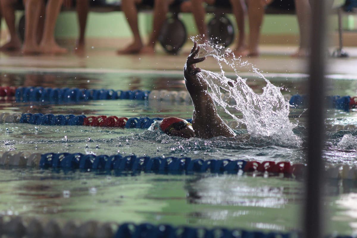 Adult Masters swimmer receiving coaching in a pool